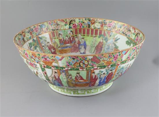A large Chinese Canton-decorated famille rose punch bowl, c.1830, W.41.5cm, section broken and restuck, and two hairline cracks